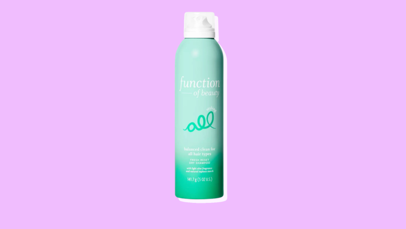 A green bottle of Function of Beauty Dry Shampoo
