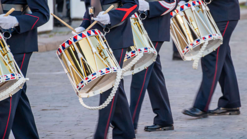 Drummers in uniform marching