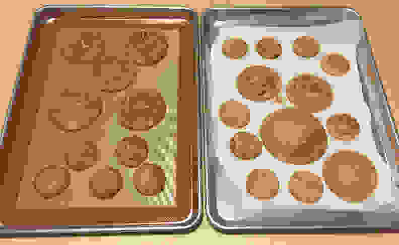 Baking mat and parchment paper on pans