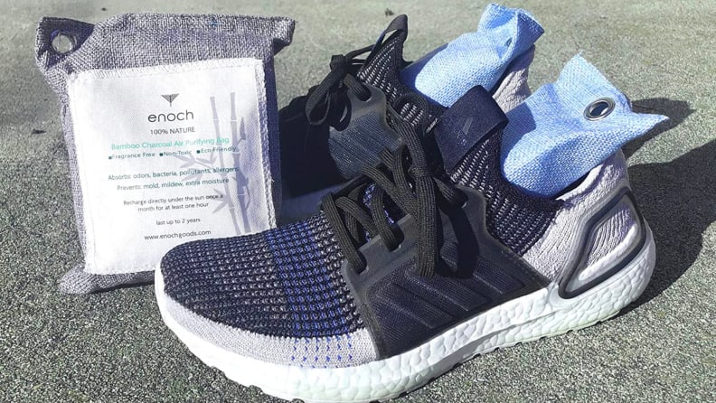 A pair of shoes with odor-eliminating packets.