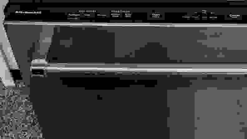 The top-mounted controls of a KitchenAid KDTE234GPS dishwasher.