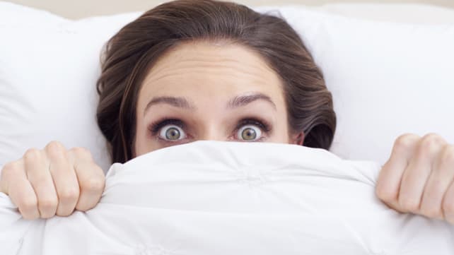 There's a gross reason you should be showering at night - woman in bed