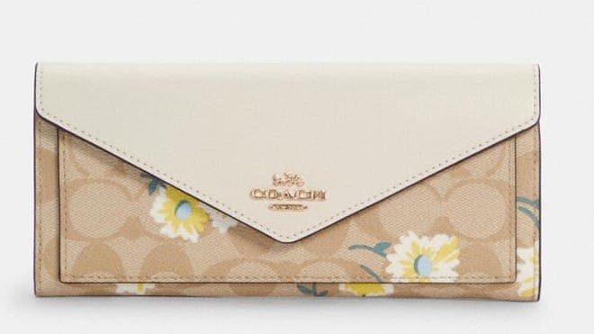 Nude Coach wallet with floral print