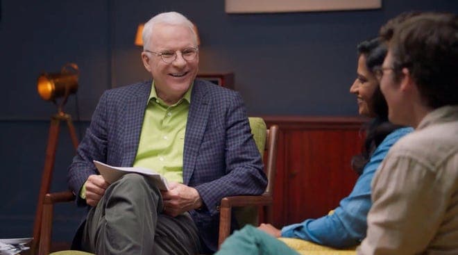 Man in chair with papers