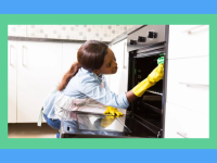 A woman cleaning her oven