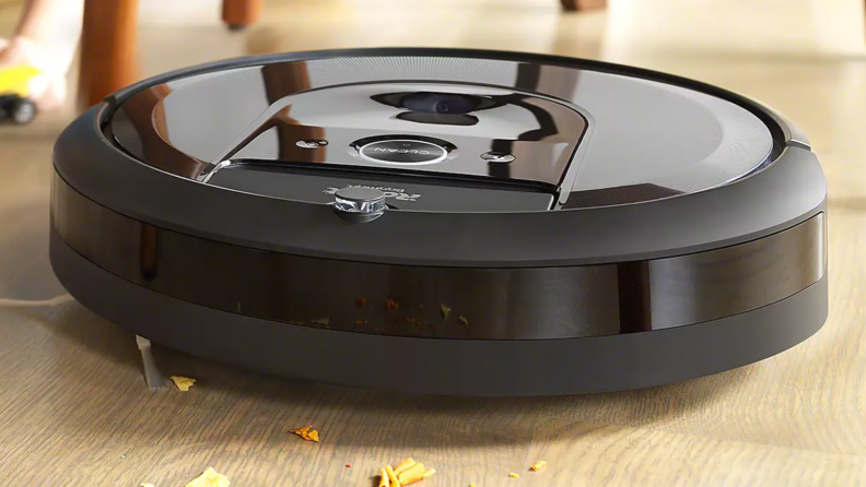A roomba cleans up a wood floor.