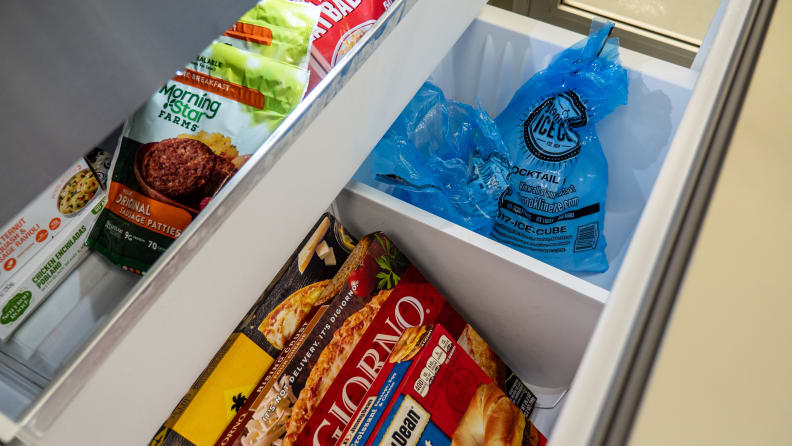 A close-up of the Bosch B36CD50SNS French-door refrigerator's freezer compartment, with some items in there for scale.