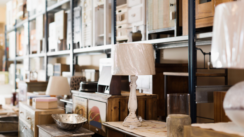 Close-up shot of a second hand shop with furniture and lamps.