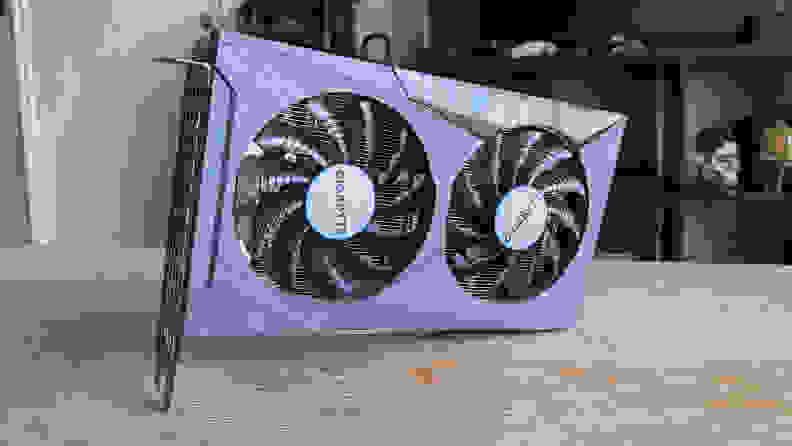 A desktop graphics card standing up on a coffee table