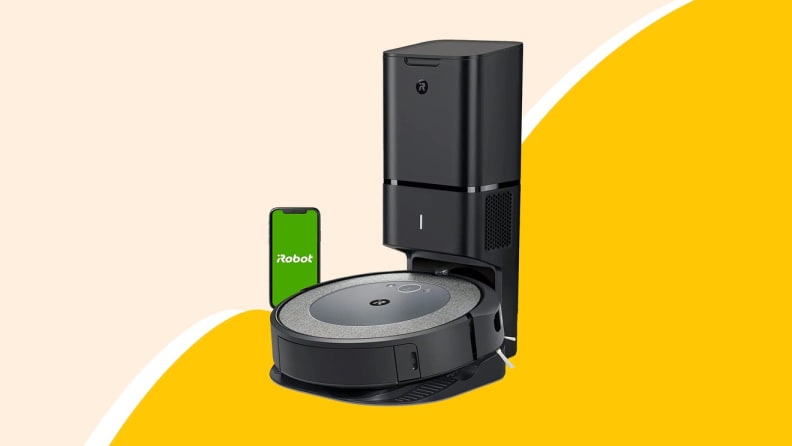 Black robot vacuum on yellow background