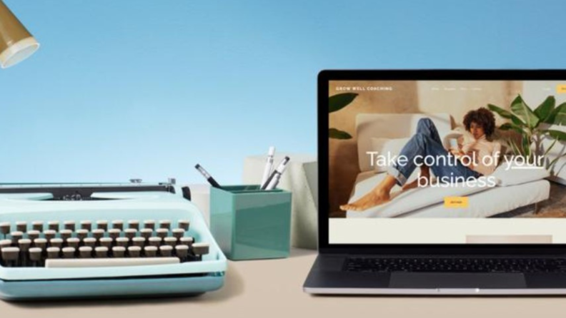 Lifestyle image of a typewriter sitting next to an open laptop with a Squarespace webpage onscreen.