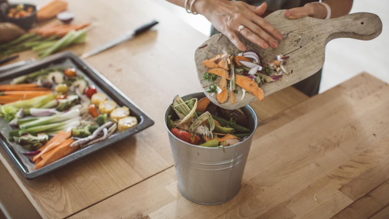 Putting food scraps into compost bins can help eliminate the use of plastic trash bags.
