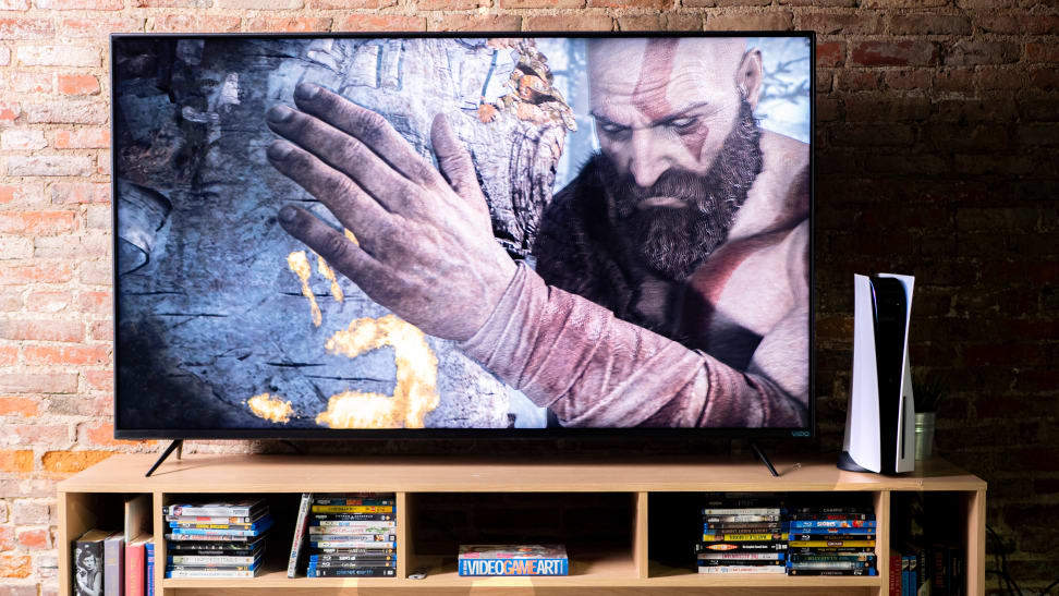 A Vizio TV displaying a 4K/HDR PlayStation 5 game in a living room setting
