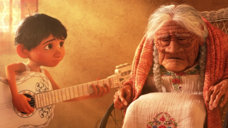 A still from 'Coco' featuring Miguel playing guitar for Coco.