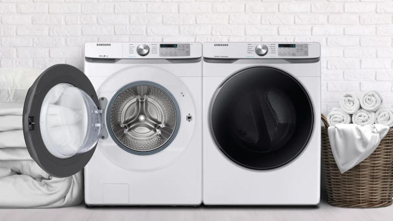 A white washer and dryer sit in a laundry room