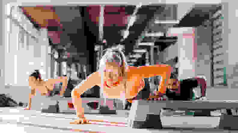 A group fitness class doing push-ups.