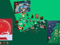 Assorted advent calendars in front of green background.