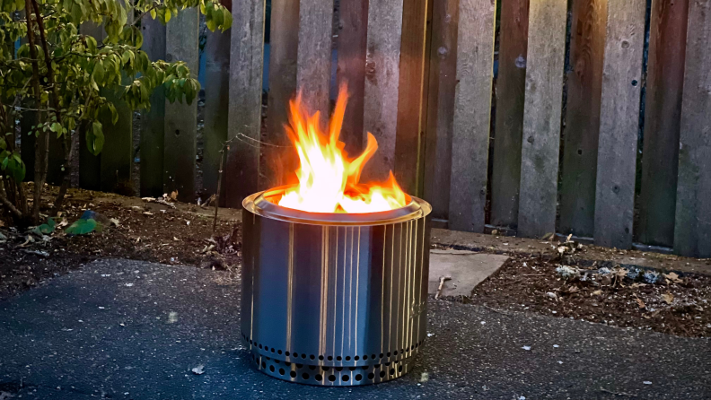 A Solo Stove burns in our testers backyard.