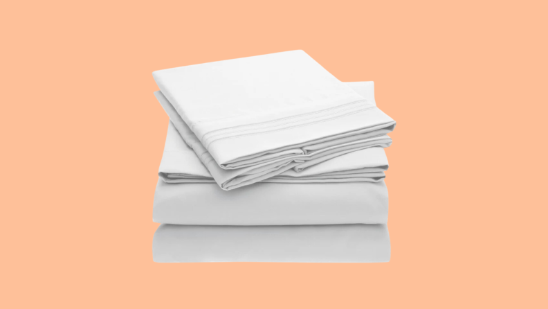 A light colored stack of sheets float above an empty peach background.