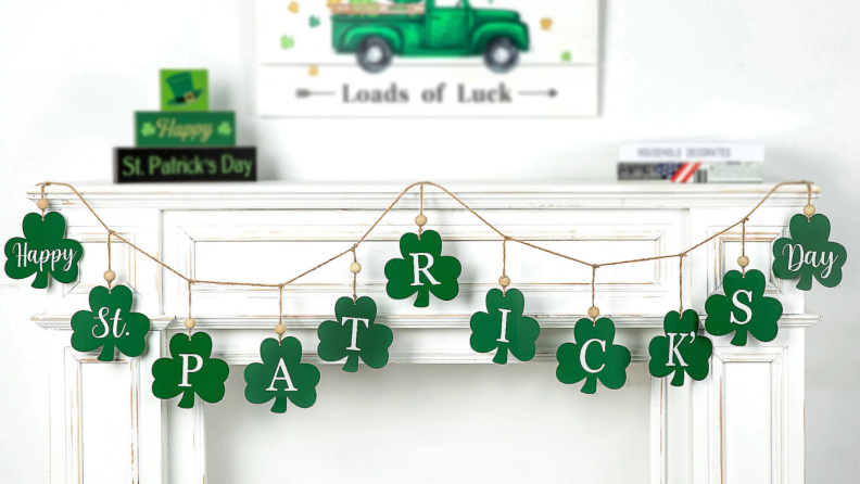 St Patricks Day themed garland hanging on mantle.