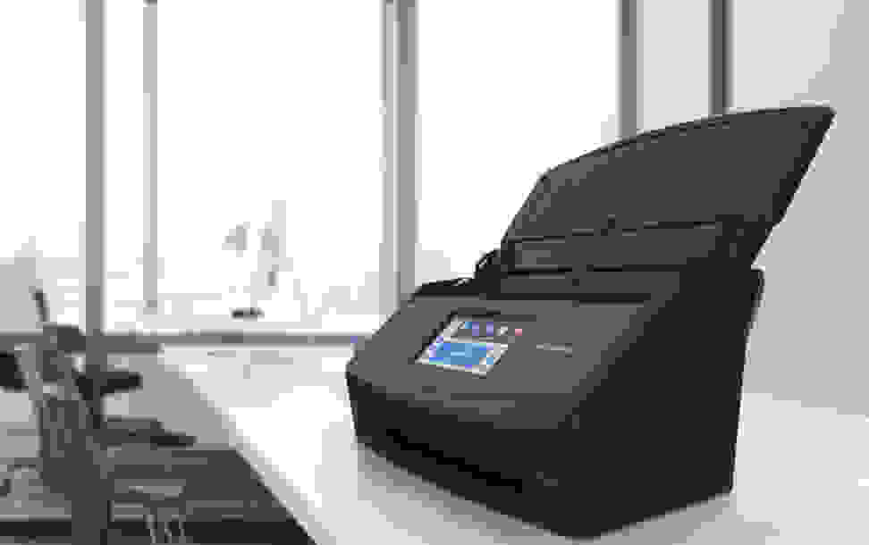 Photo of a Fujitsu document scanner on a tabletop.