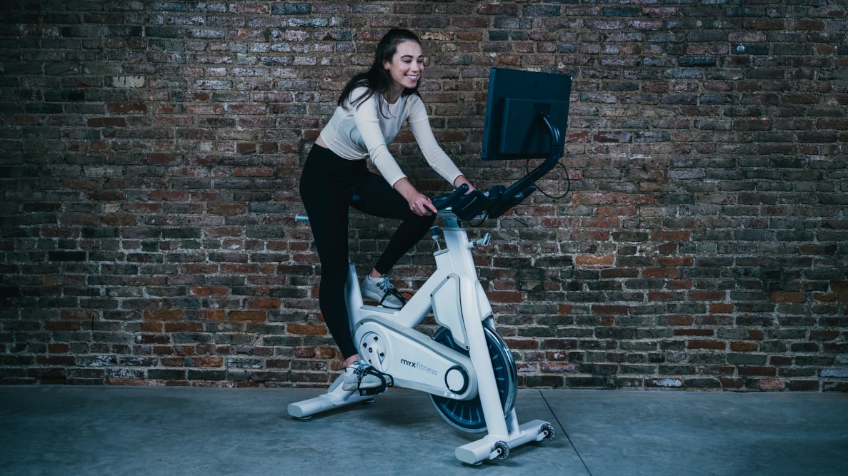 woman sitting on myx exercise bike
