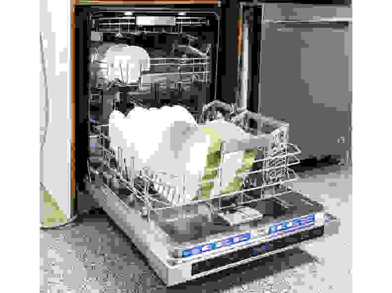 The dishwasher's interior is spacious and brightly lit
