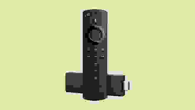 Amazon Fire Stick 4K against a beige background