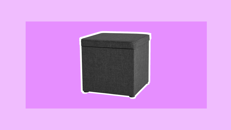 Cube-shaped gray cloth covered ottoman to place in your dorm room for extra storage.