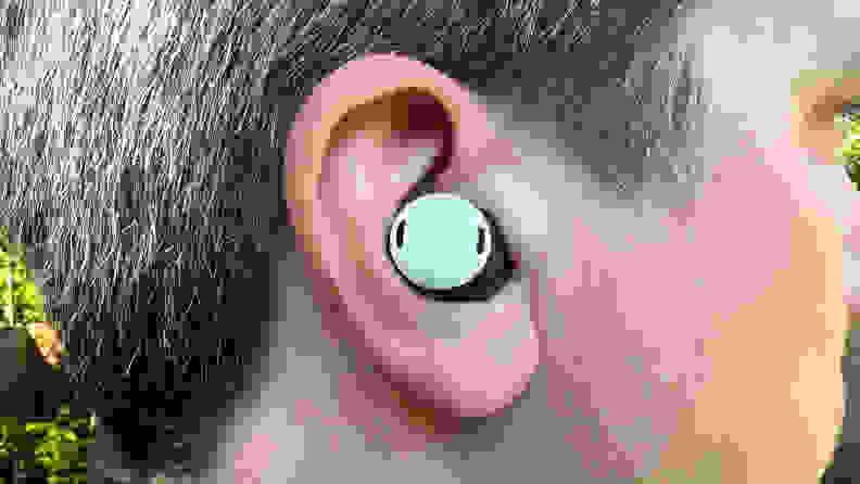 A close up of a Pixel Bud Pro in a man's ear.