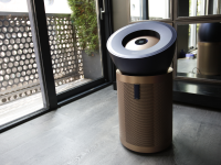Dyson Big+Quiet Formaldehyde Air Purifier indoors in front of large sliding glass door.