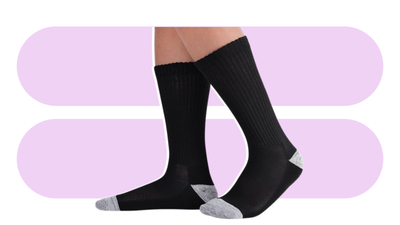 Two black calf-height socks against a purple background.