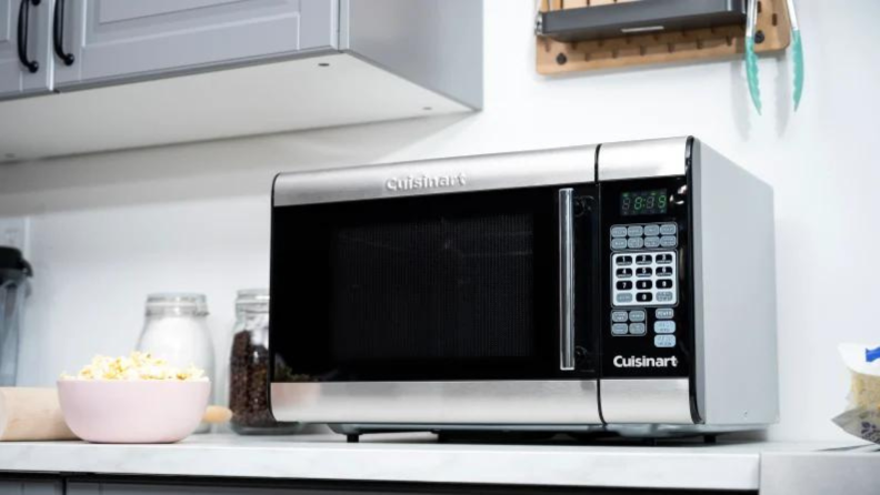 A countertop microwave sitting on a counter in a kitchen.