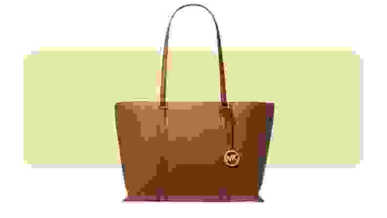 A tan oversized leather tote bag.