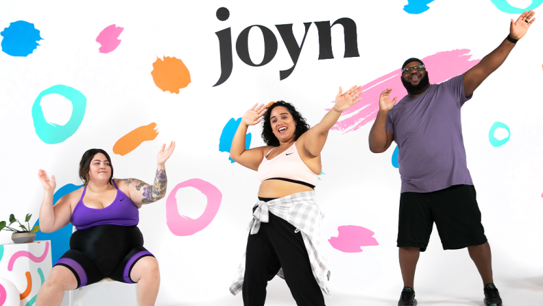three people exercising in front of polka-dot background