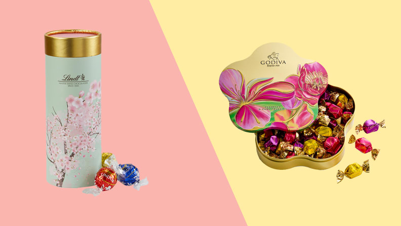 A green Lindt truffle canister with a red, blue, and yellow wrapped truffle next to it against a pink background on the left. An open Godiva truffle canister against a yellow background on the right.