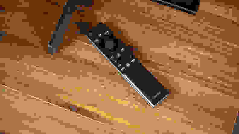 A close-up of the Samsung AU8000's remote control