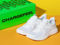 White Lululemon Chargefeel sneakers next to a green Chargefeel box