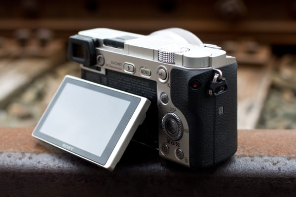 The A6000's LCD can tilt 90 degrees upwards or about 45 degrees downward, letting you frame from tough angles.