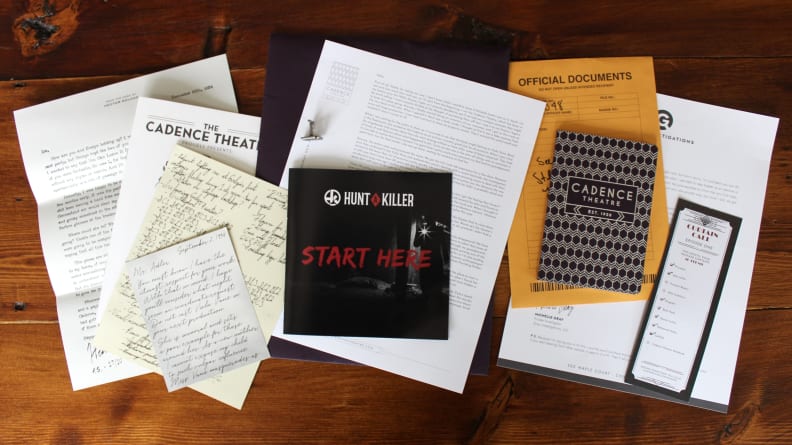 Hunt a Killer subscription box clues on table