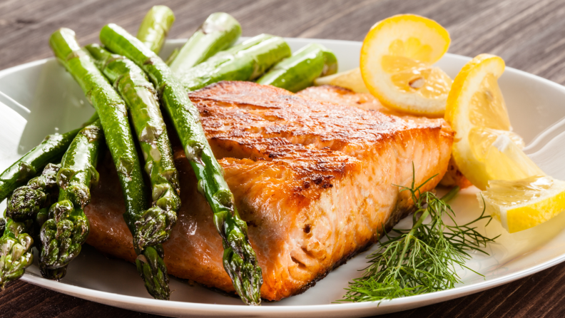 salmon and asparagus on plate