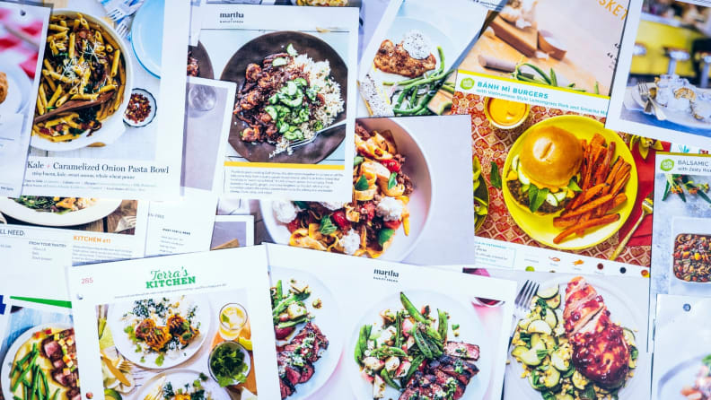 Recipe cards from different meal kits splayed out