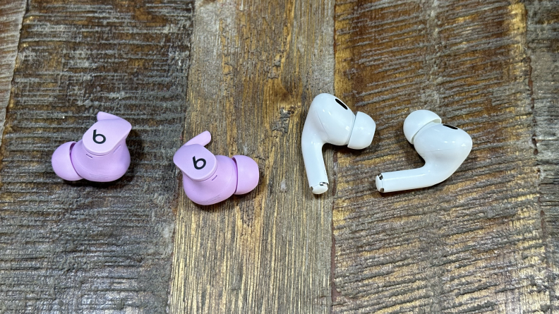 A close shot of the Beats Fit Pro and Apple AirPods Pro sitting on a wall.