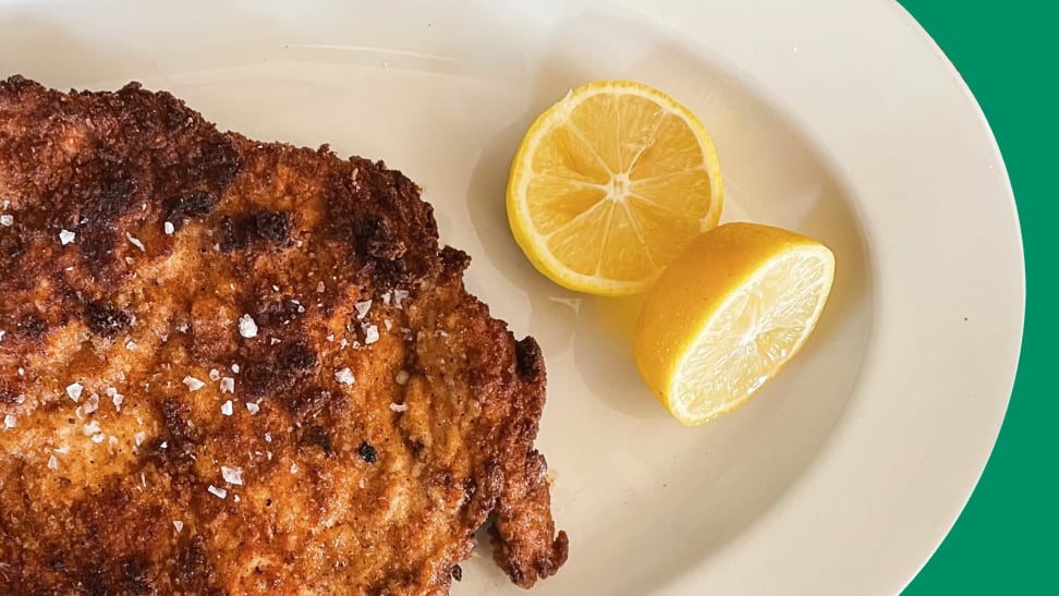 Pork schnitzel on a plate with a cut lemon