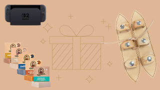 A Nintendo Switch, leather shoulder pads and Dr Squatch soap on an image with a beige background