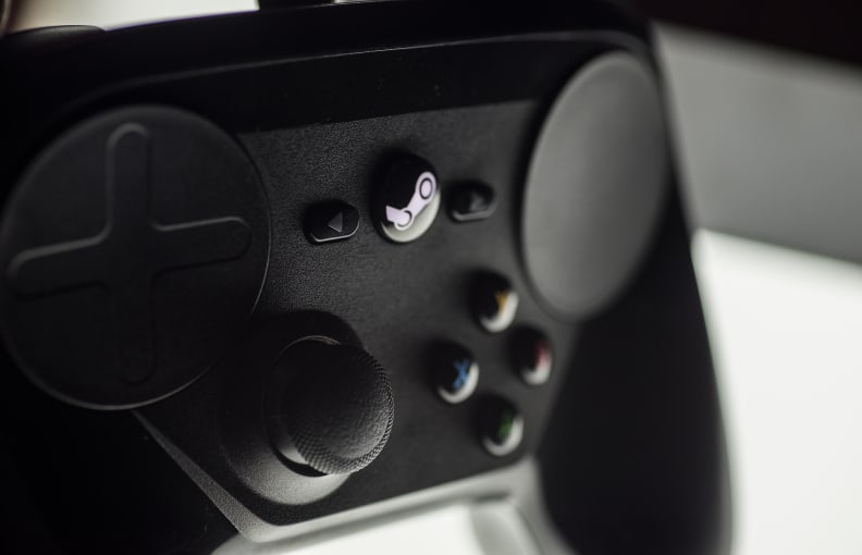 A close-up photo of the Valve Steam Controller's front control interface.