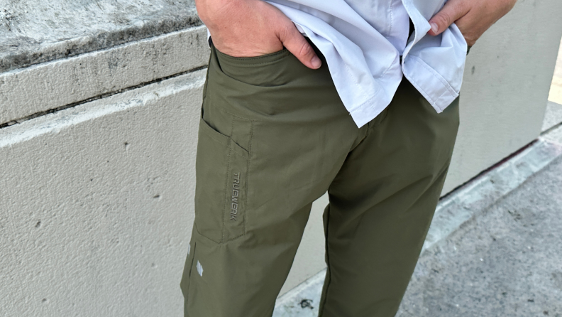 Close-up of the author wearing olive-colored cargo pants and a gray button-up shirt.