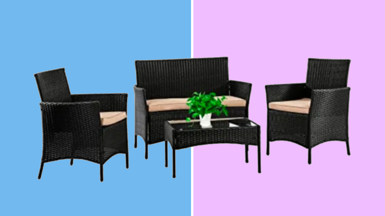 An image of a four piece patio set in black wicker, with a glass topped table, two chairs, and a loveseat. The loveseat and chairs all have cream-colored cushions.