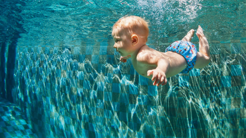 Baby swimming in pool