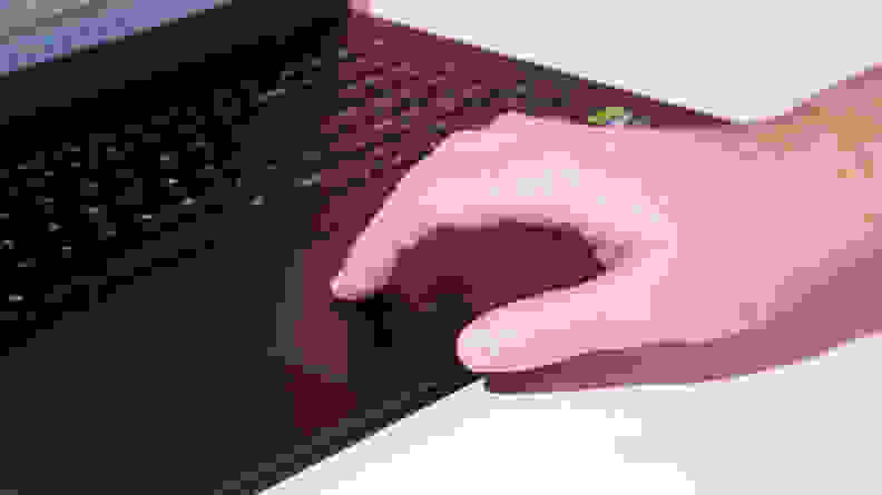 A man touching the mouse pad on the LG gram Pro 17 laptop.